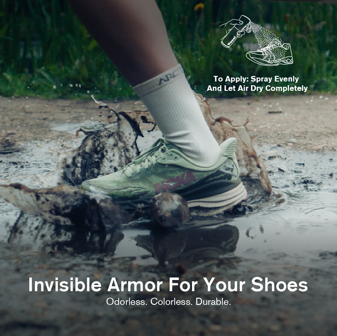 Person wearing a shoe with visible wear and tear stepping into a muddy puddle, promoting 'Invisible Armor For Your Shoes'.