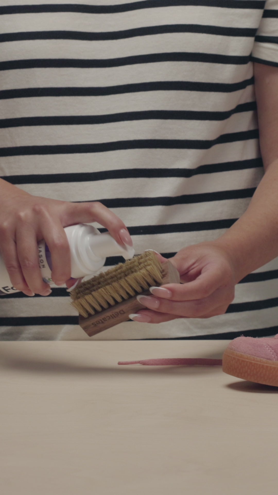 APPLYING JASON MARKK FOAM CLEANER ON TO A JASON MARKK DELICATES CLEANING BRUSH